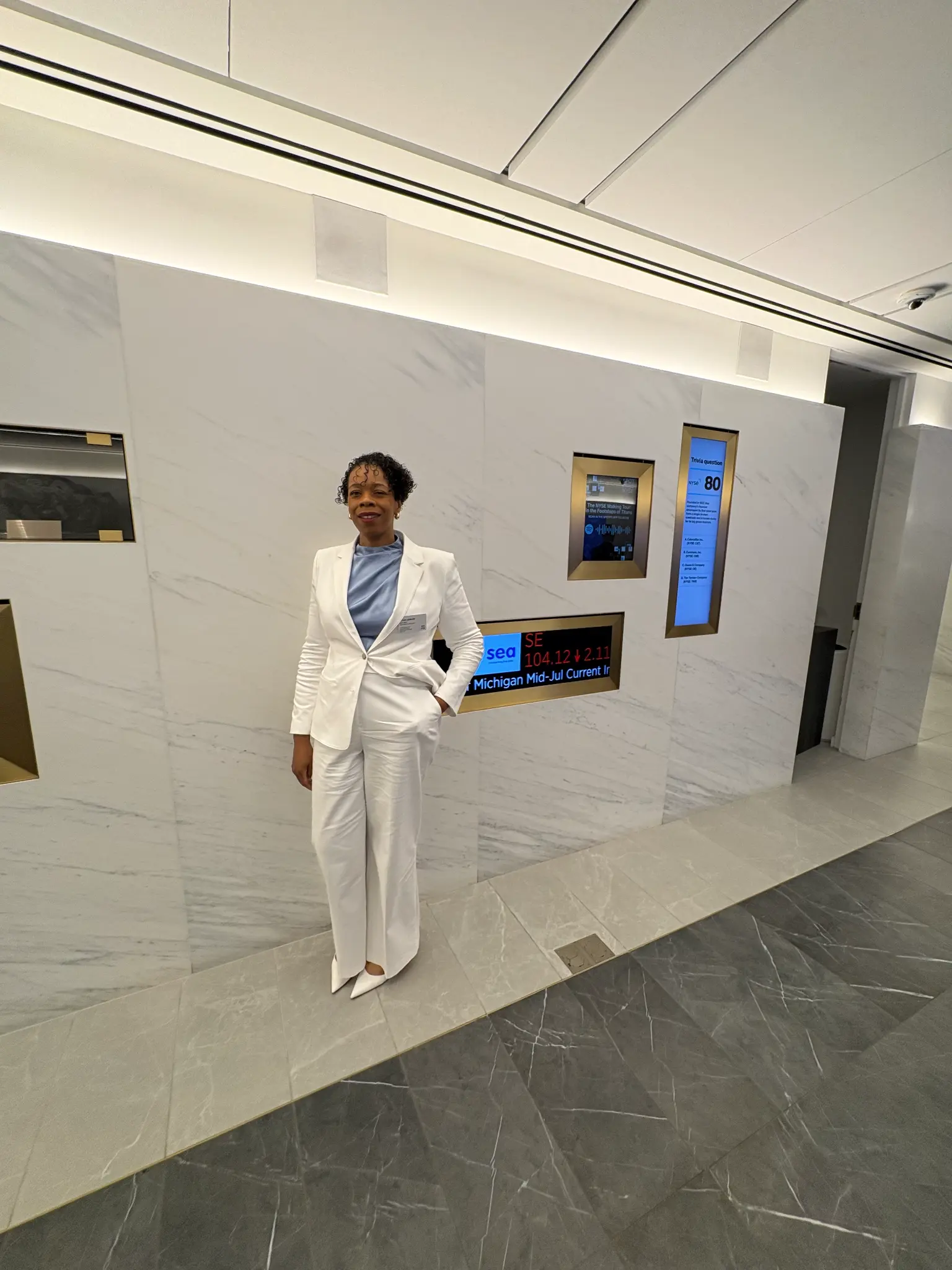 Atiyah Jemison in a white suit during her July 2026 New York Stock Exchange visit